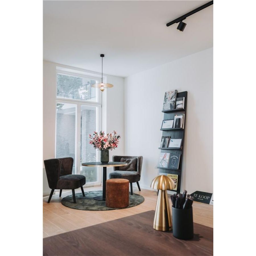 INA lounge chair with round wooden legs
